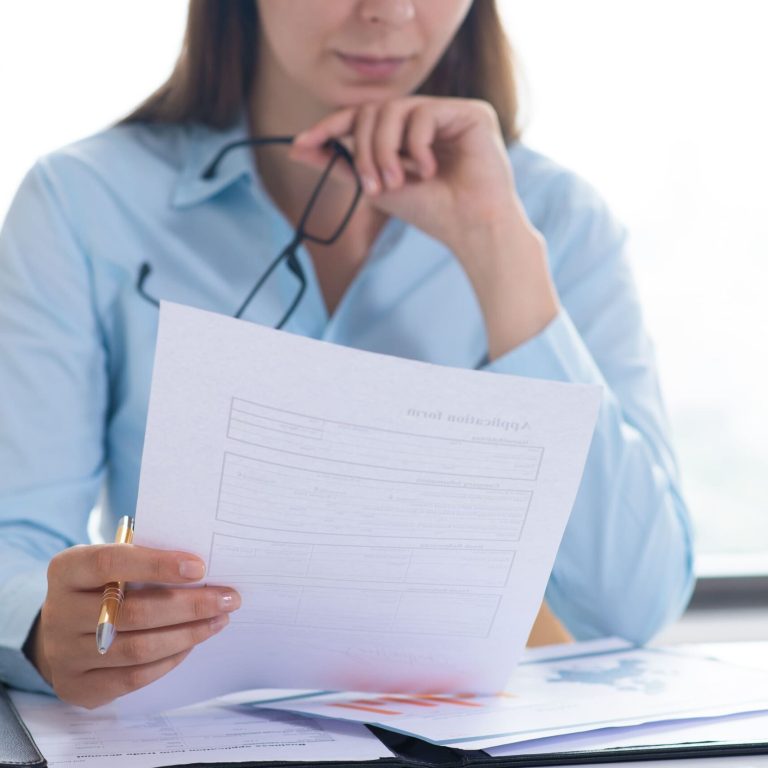 closeup-woman-holding-reading-document